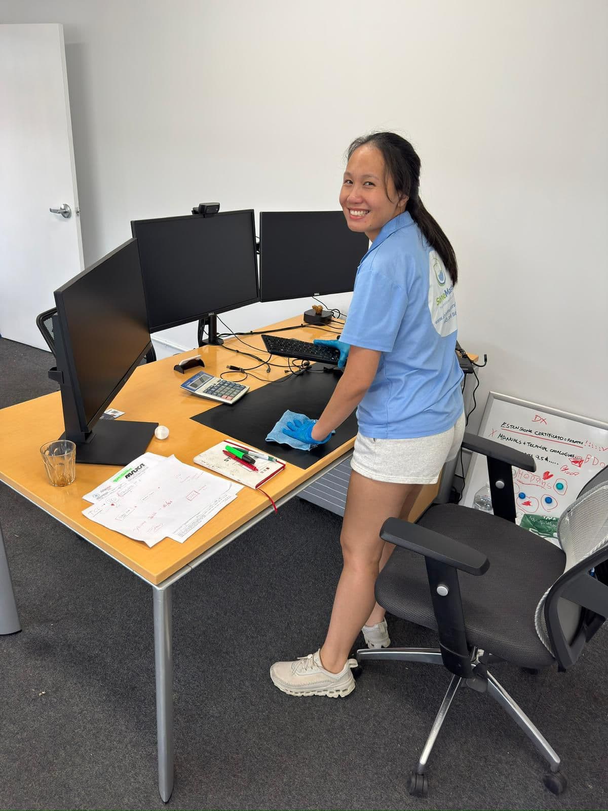 ShineMasters cleaner wiping office desk, commercial cleaning Sydney